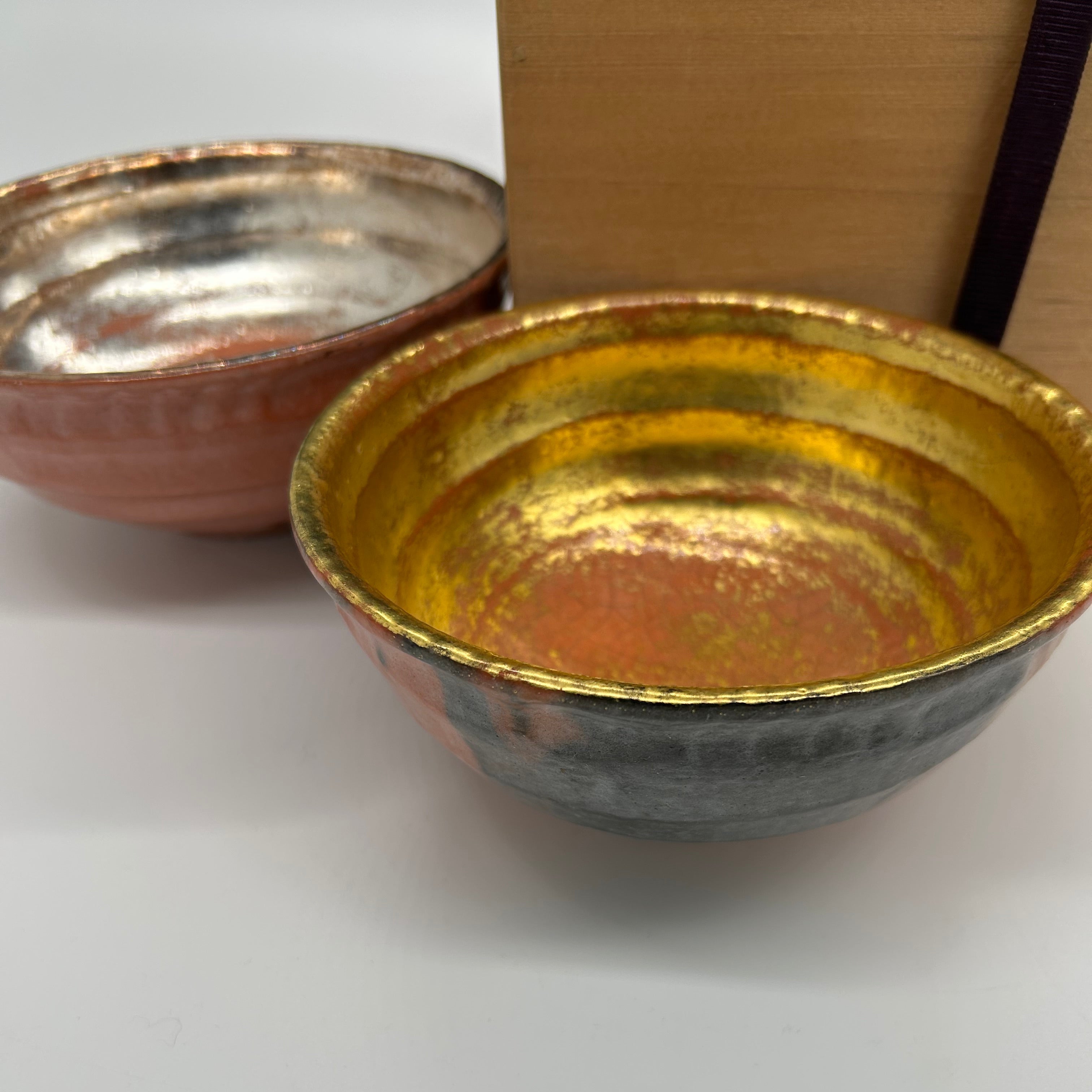 Japanese raku bowls with gold and silver leaf