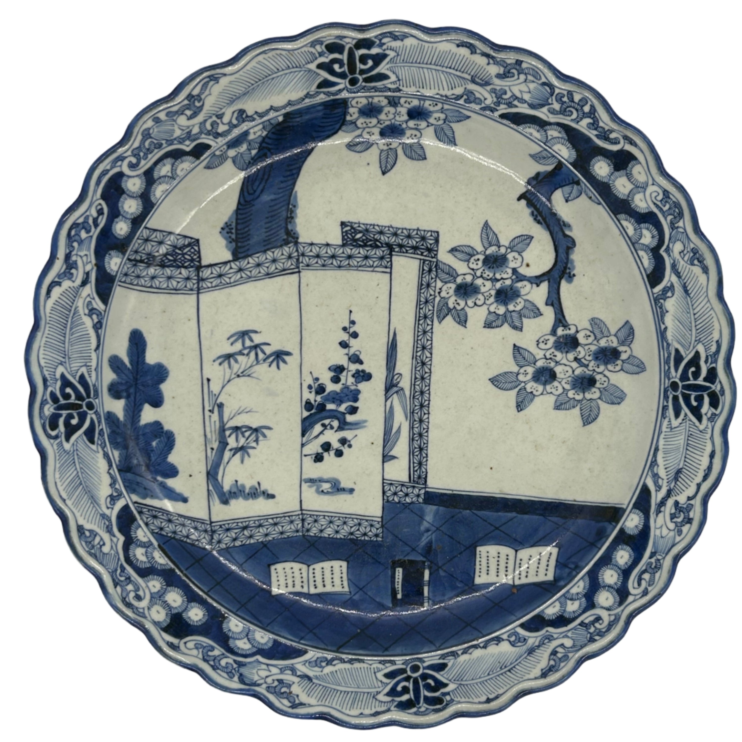Blue and white decorative plate with floral and byobu design