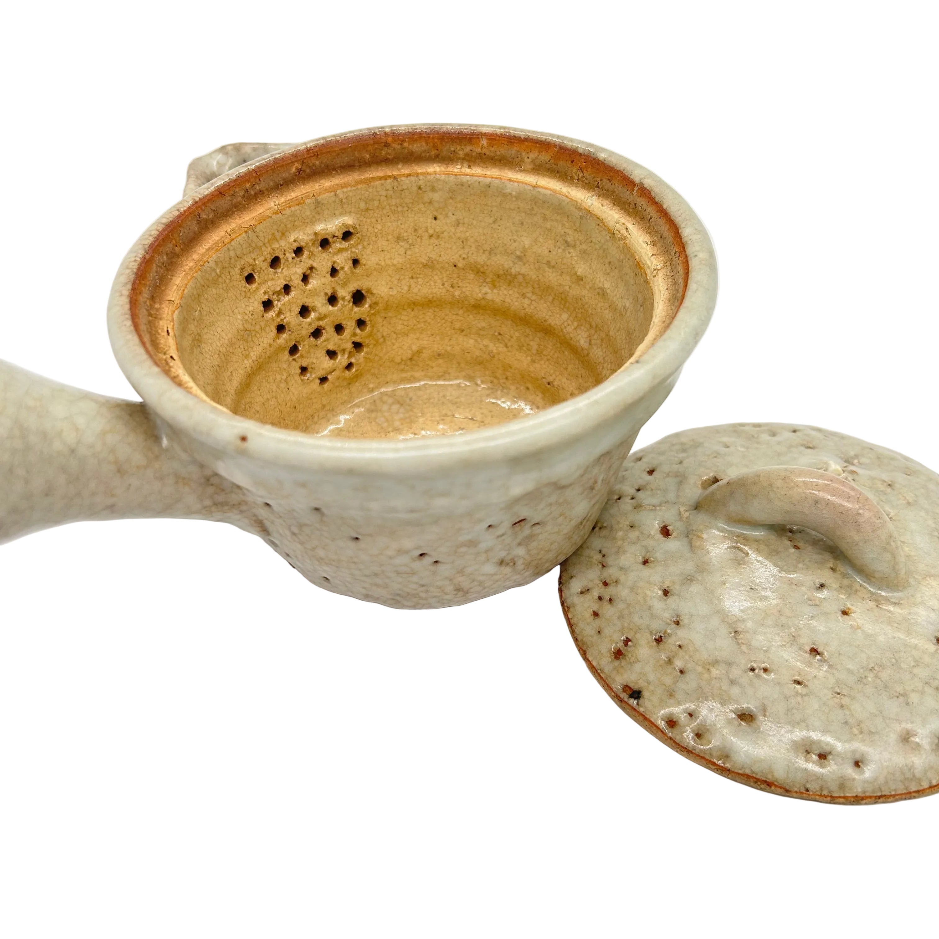A Japanese Shino pottery tea bowl with the distinctive style of Shino ware.