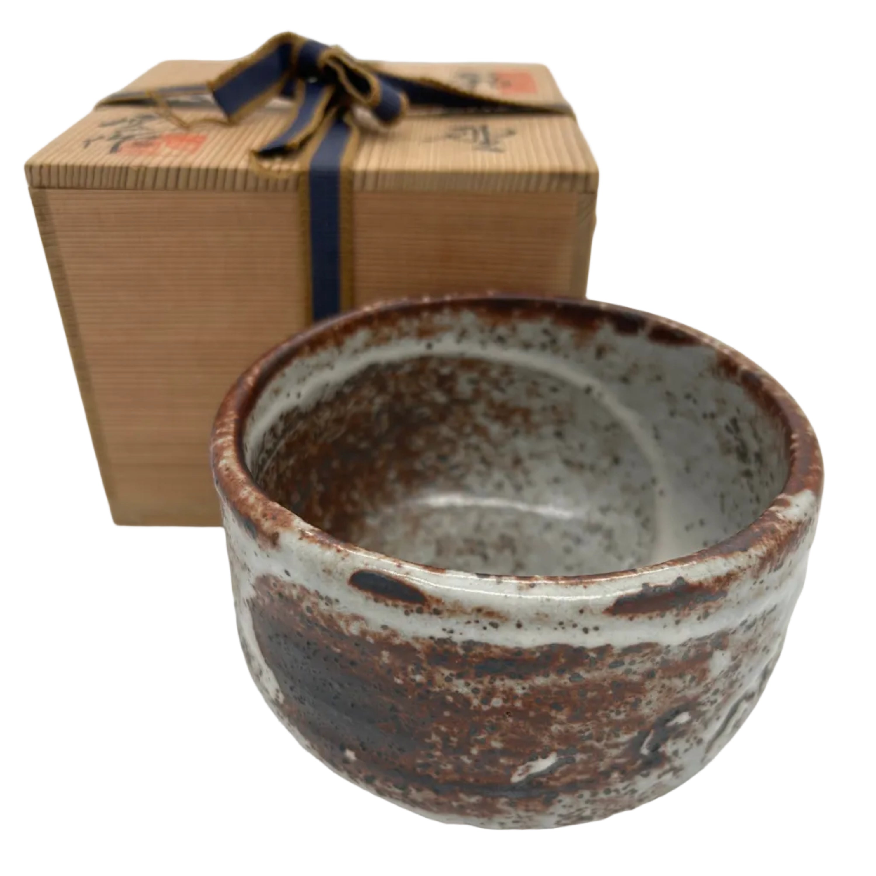 A Japanese pottery tea bowl (chawan) with an organic feel and a wonderful warm glaze. Kazari

This item comes with its original signed box.