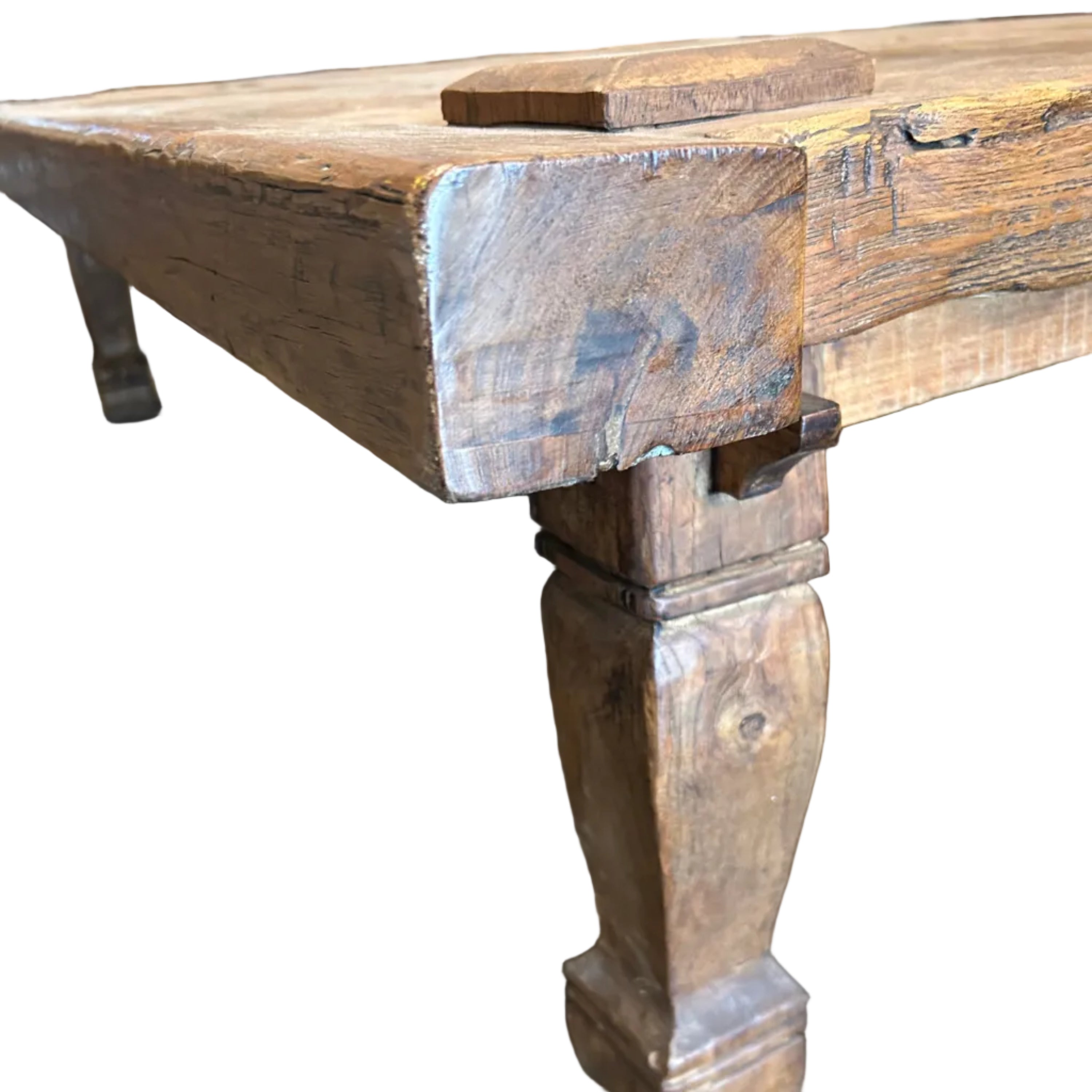 A large rustic teak coffee table