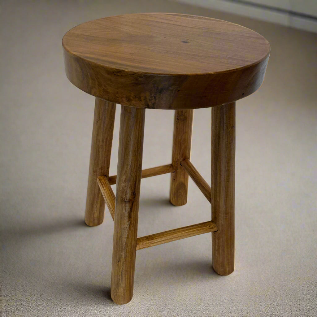 Sturdy four-legged wooden stool with rustic charm. Compact, versatile, and durable—ideal as a seat, side table, or display stand.