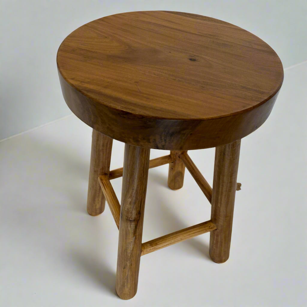 Sturdy four-legged wooden stool with rustic charm. Compact, versatile, and durable—ideal as a seat, side table, or display stand.