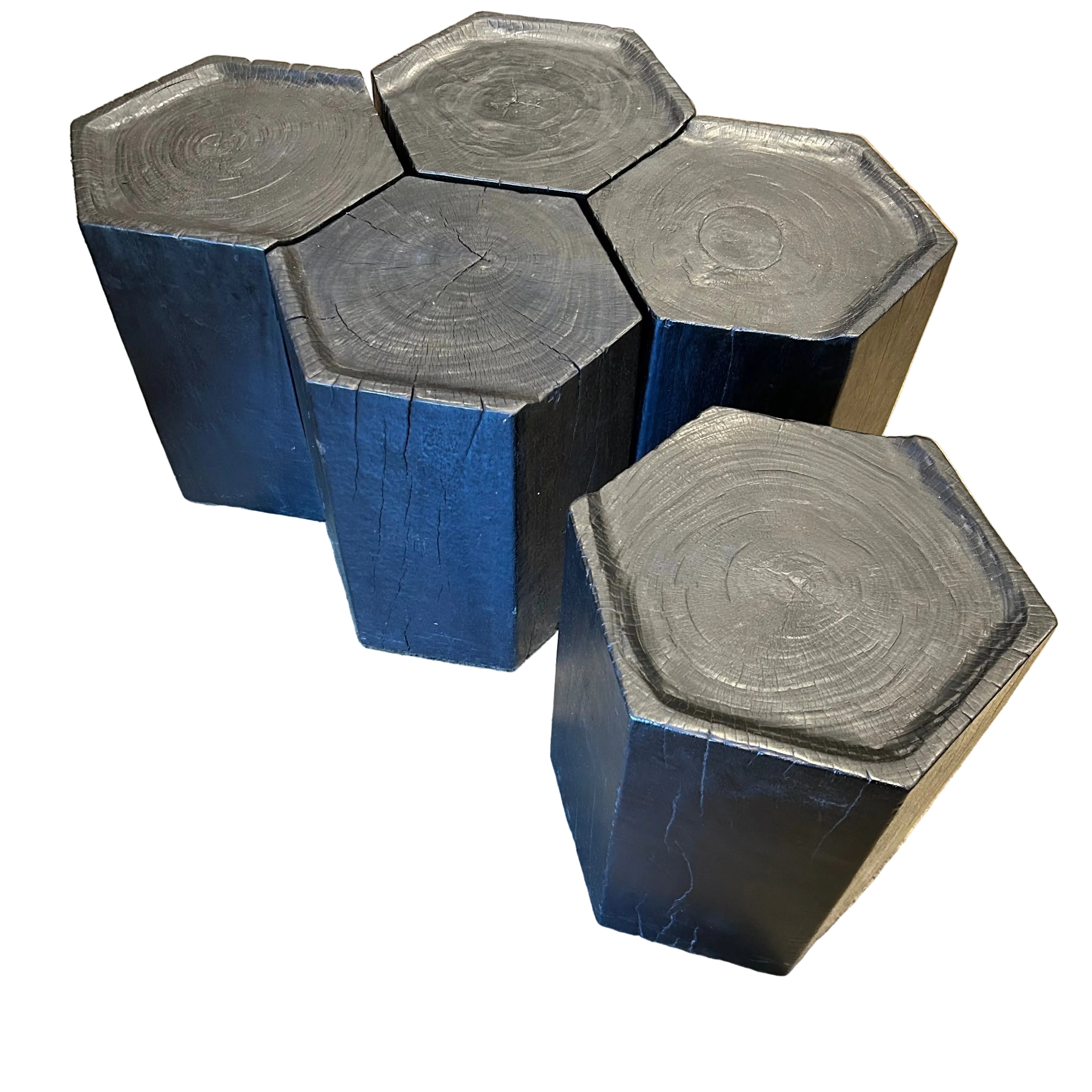 Set of five hexagonal stools in solid ebonized timber. Modular design slots together to form a larger table. Each 35 × 35 × 47 cm.