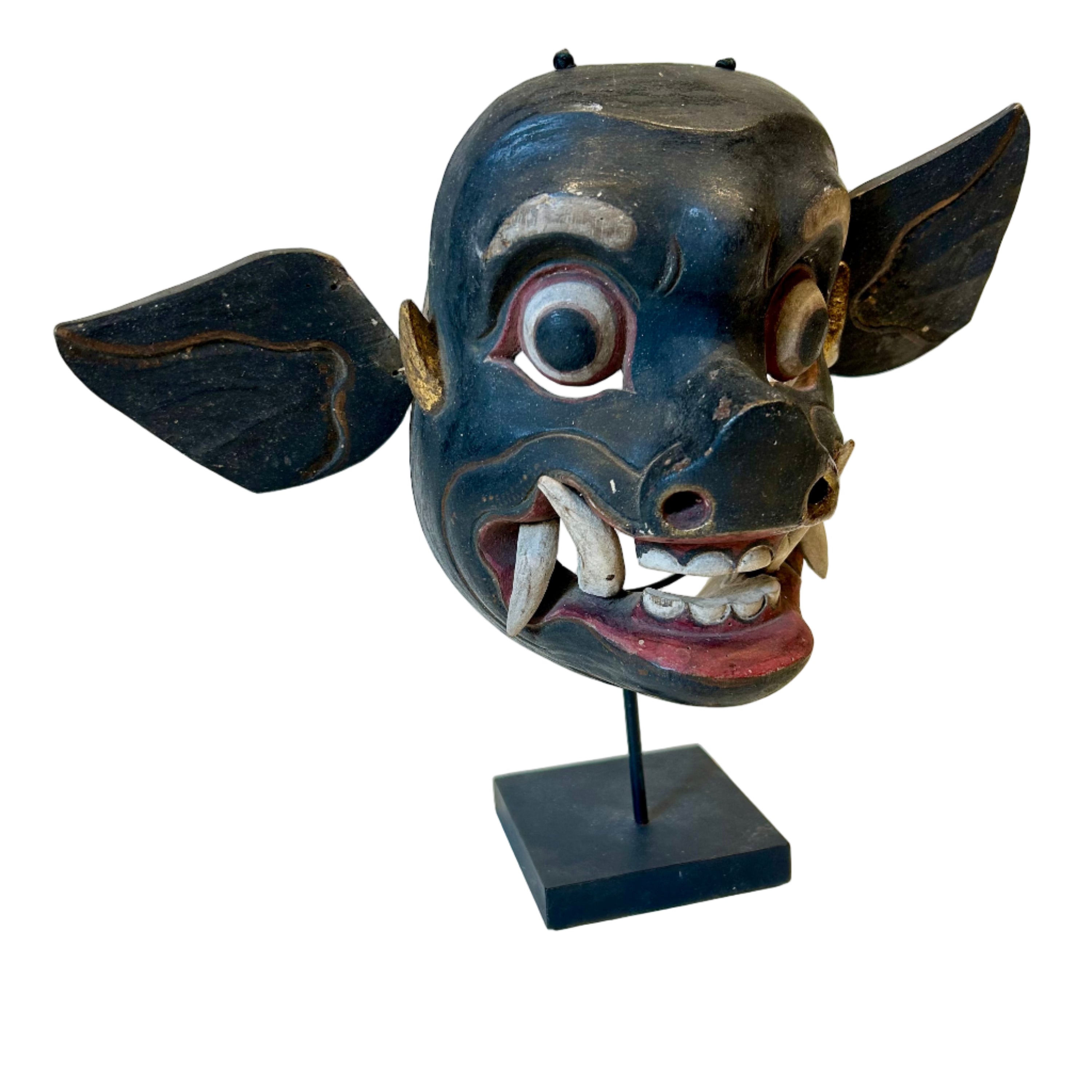Traditional Indonesian mask on a stand 