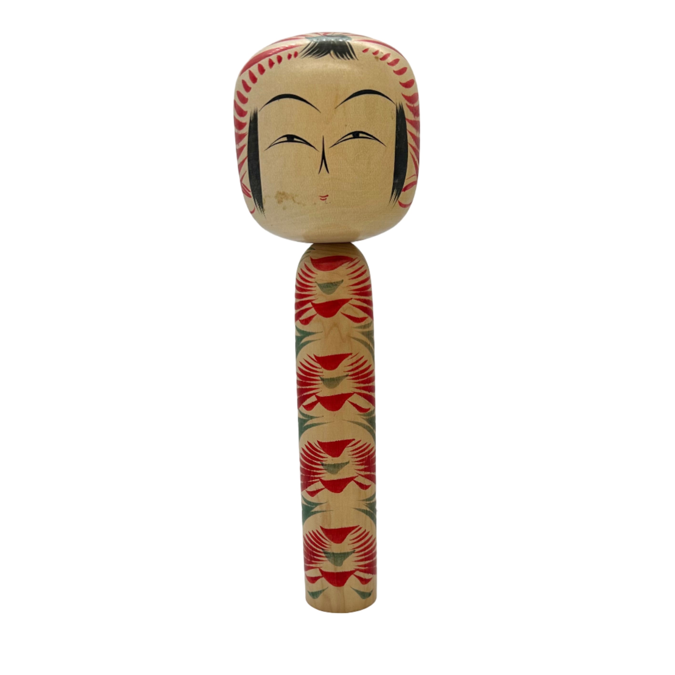 Traditional kokeshi doll with decorated torso