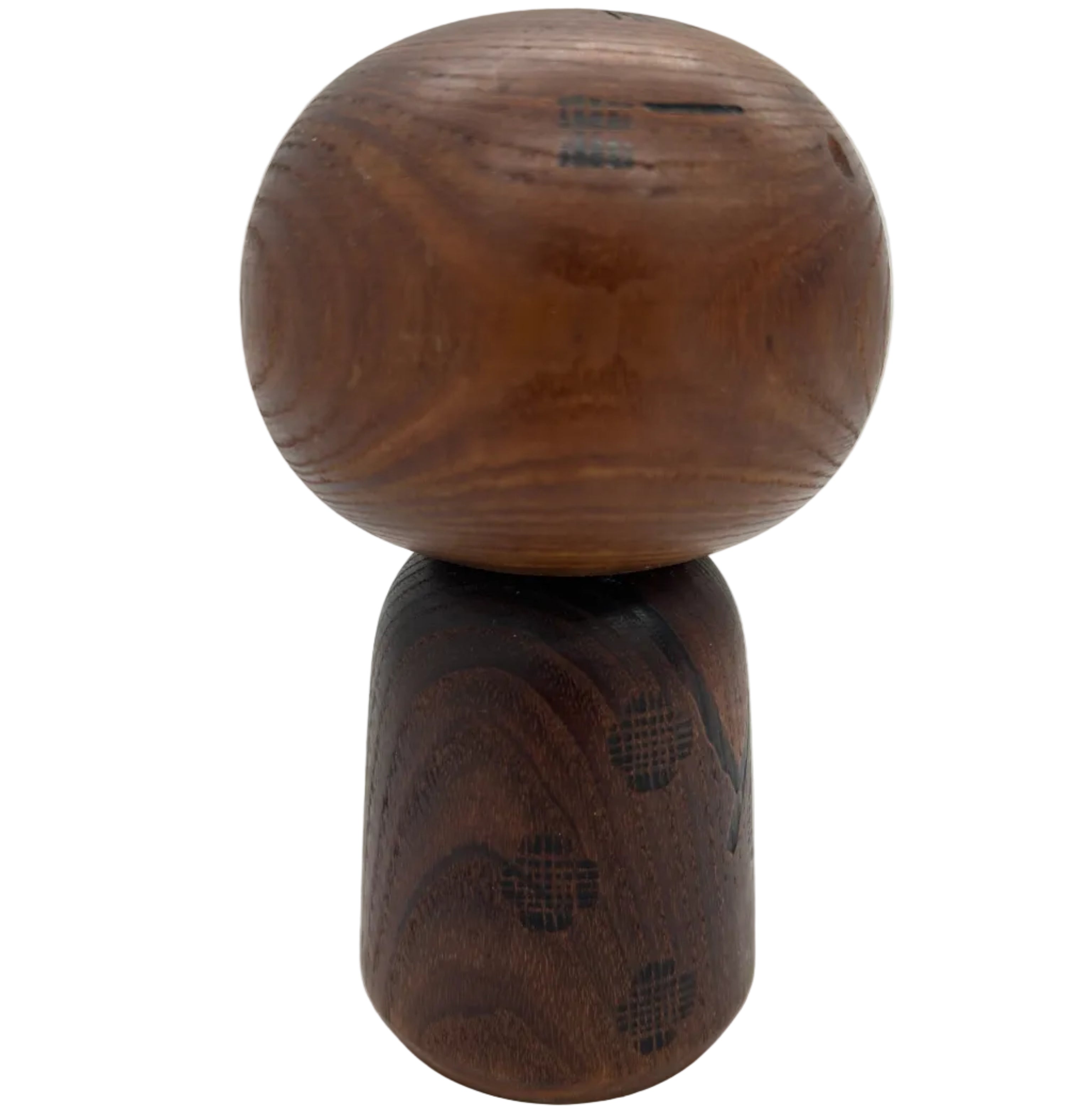 A vintage traditional Japanese kokeshi from the 1960's. She is an individual - dark, short and subtly decorated.