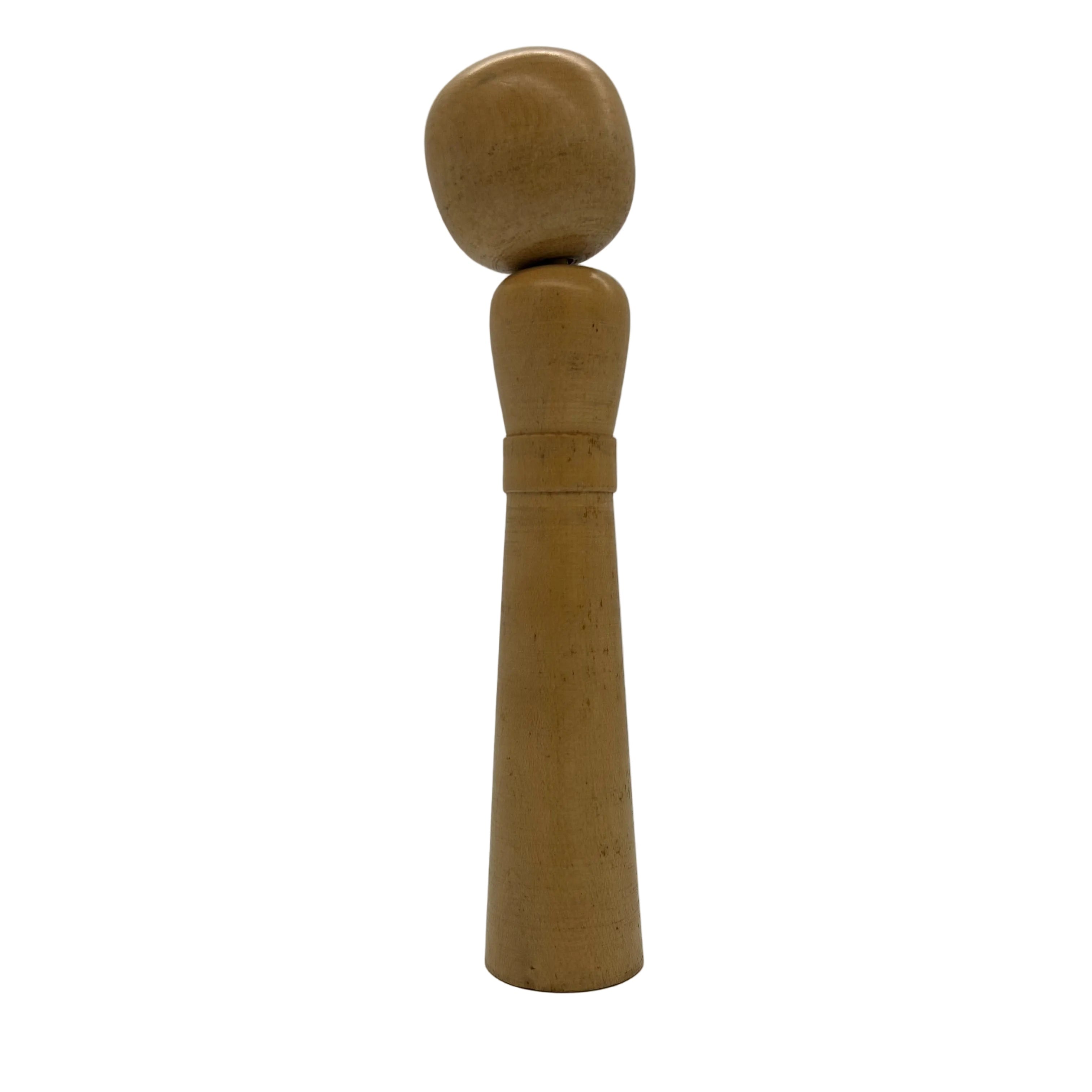 A vintage traditional Japanese Nambu (Kina-Kina) Kokeshi. This family of traditional dolls might well be considered the original Kokeshi, as it is said they were modeled after a baby’s pacifier.