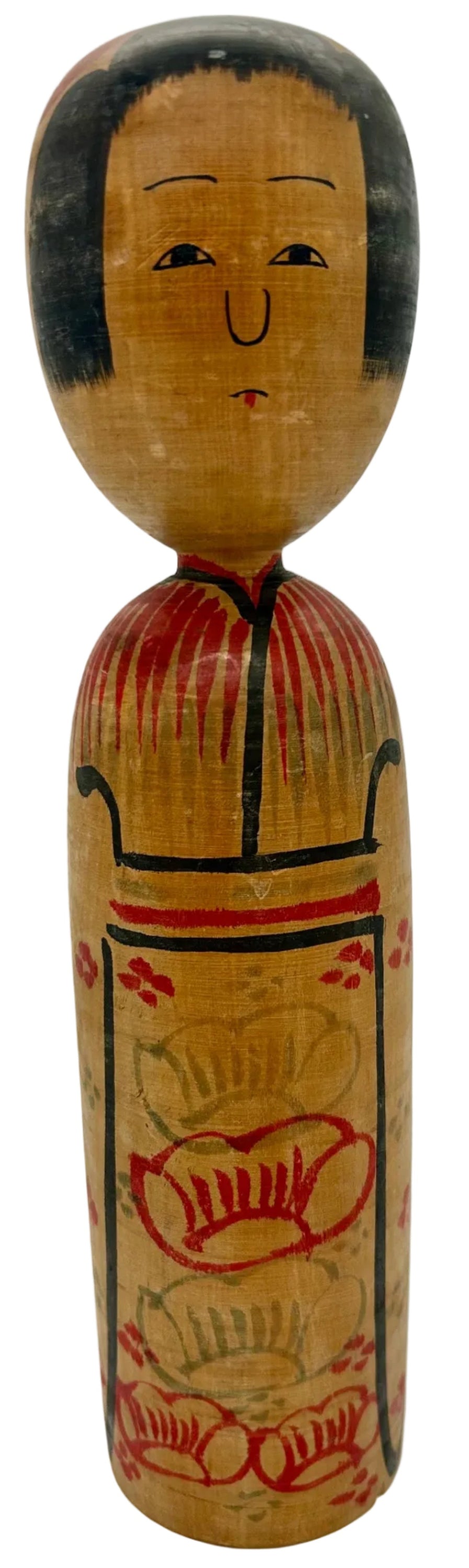 This is a traditional Japanese Kokeshi doll crafted by the renowned Living National Treasure, Kyutaro Ogura (1906 - 1998 92 years). Originating from Akita Honjiyama, this handcrafted wooden doll features a classic design with floral motifs, showcasing Japan's rich cultural heritage. The doll measures approximately 31 cm in height and is decorated with red and black accents on its natural wood finish. On the back, there is a handwritten signature, confirming its authenticity and craftsmanship.&nbsp;