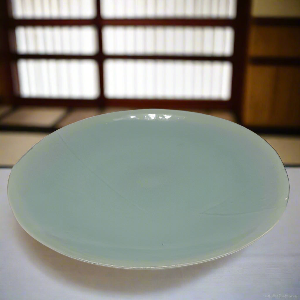 Japanese celadon porcelain charger. Signed and with it's original Paulonia box.
