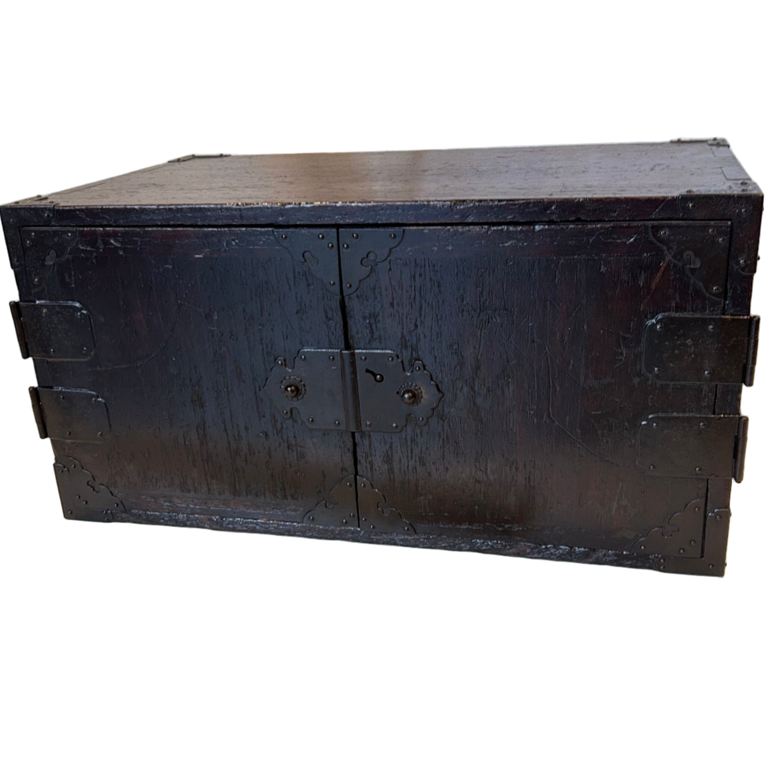 A Japanese accounts chest with double doors for security. Made from paulownia wood with iron hardware.  EDO period C1800.
