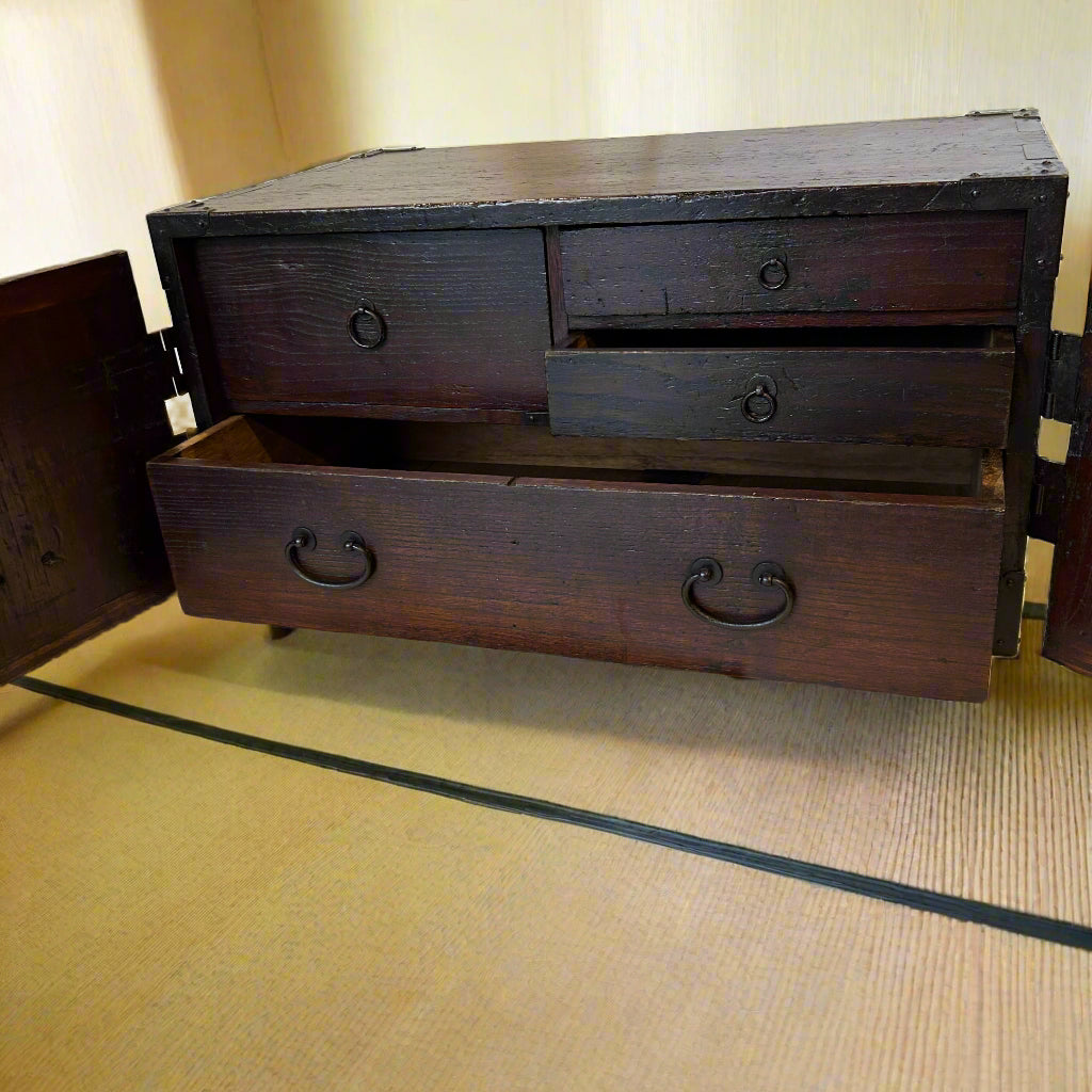 A Japanese accounts chest with double doors for security. Made from paulownia wood with iron hardware. EDO period C1800.