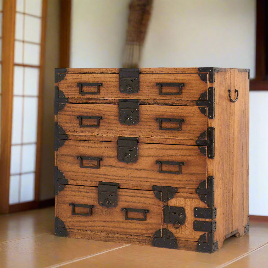 Japanese paulownia wood chest of 4 external and 2 internal drawers with iron hardware. 19thC.