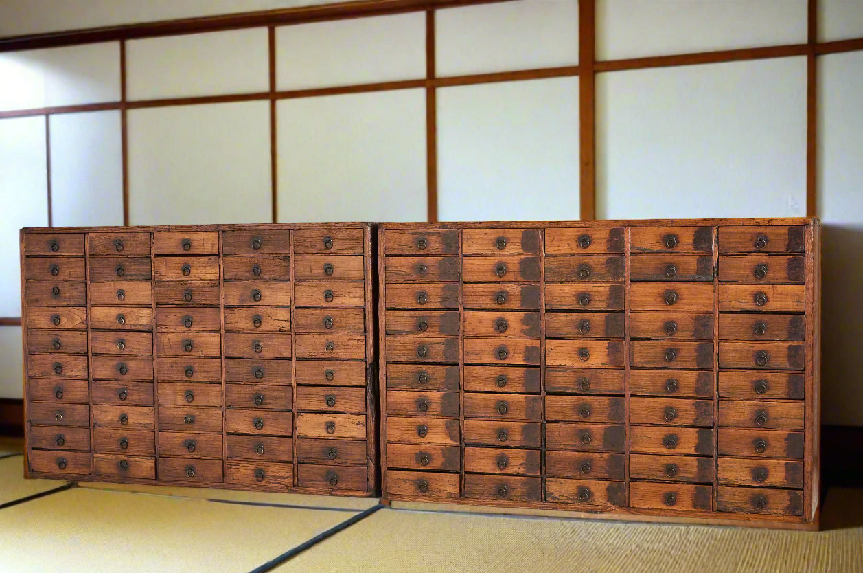 A pair of Japanese medicine chests (kasuri-dansu). Made from paulownia wood and each with 50 drawers. EDO period C1850.