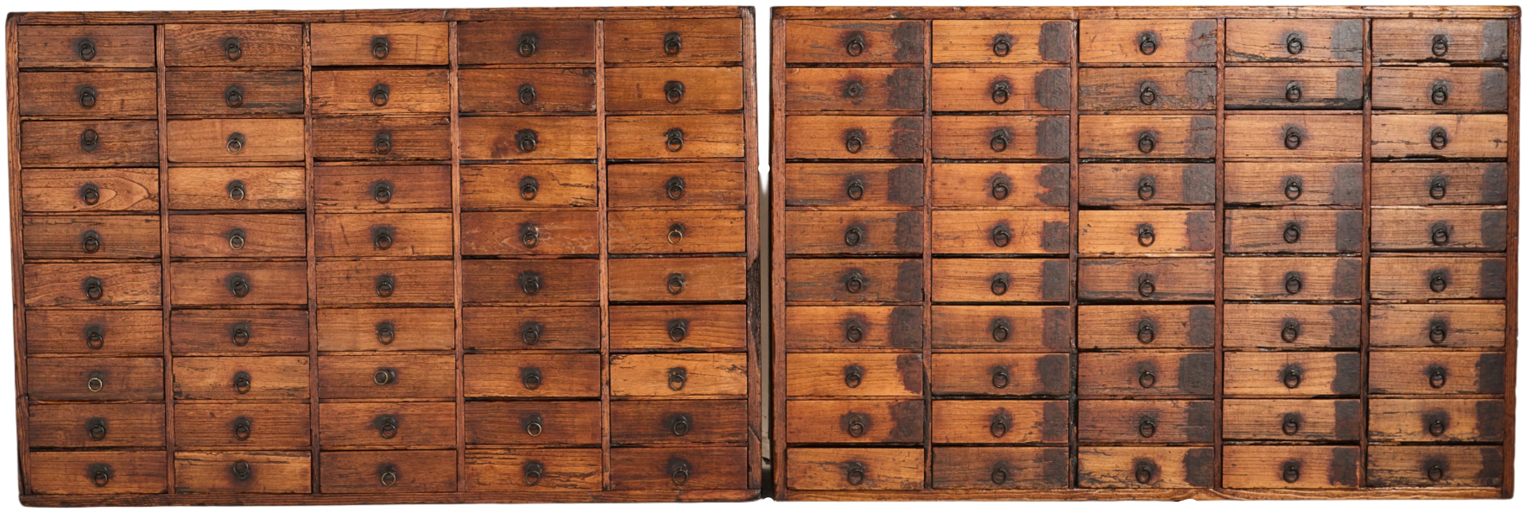A pair of Japanese medicine chests (kasuri-dansu). Made from paulownia wood and each with 50 drawers. EDO period C1850.