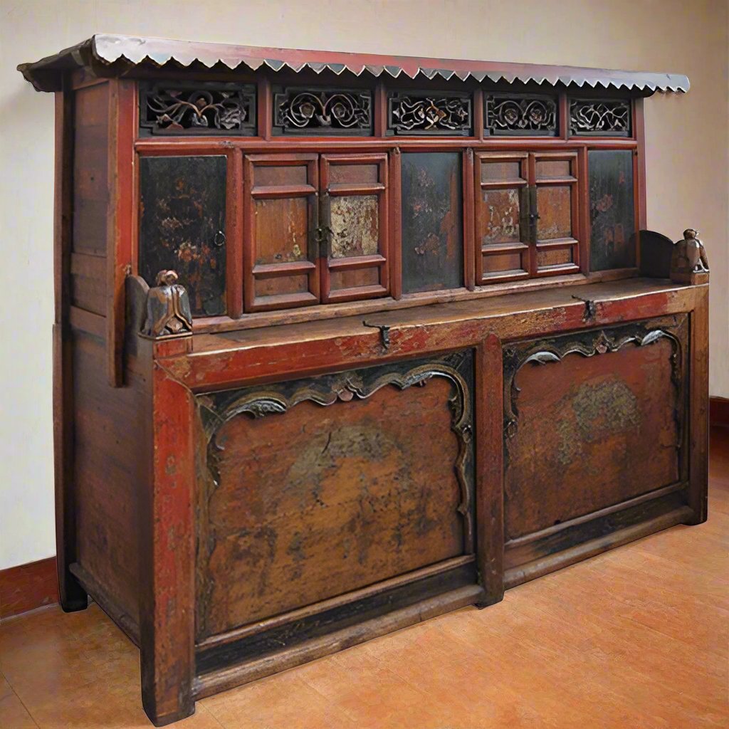 Kazari. A rare and antique Tibetan rice storage chest with eight doors painted in vibrant tones of red, black and green. Decorated with carved and painted floral motifs.

Late 18th - early 19th century.