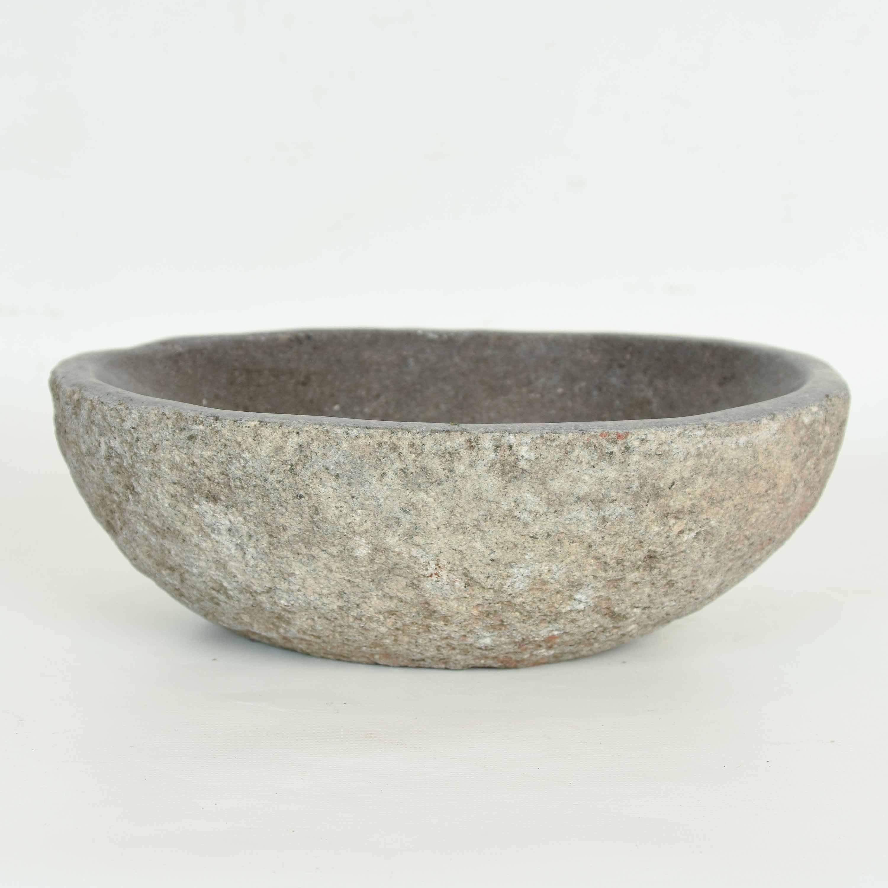 A basalt stone water bowl. The exterior of the bowl remains a natural stone finish. As this is a natural product the dimensions and shape may differ slightly.