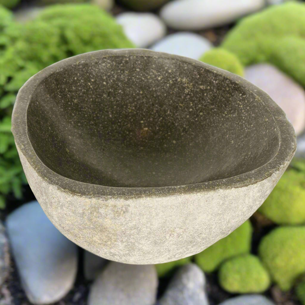 A small contemporary stone bowl made from&nbsp;basalt with a natural hewn exterior and a polished interior.&nbsp;