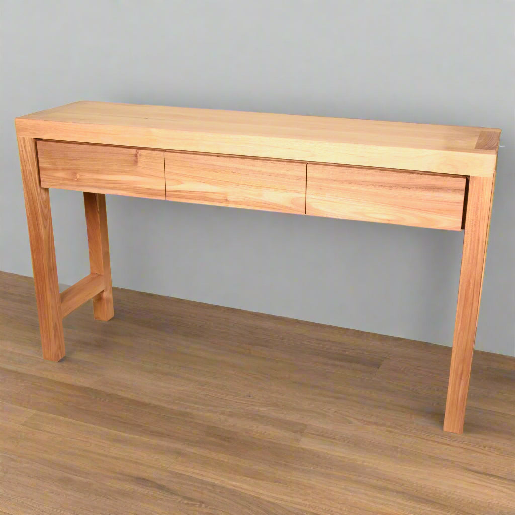 Contemporary Scandinavian style 3 drawer console made by fine craftsmen from sustainably sourced solid teak (not veneer or laminate) in a natural wax finish. 