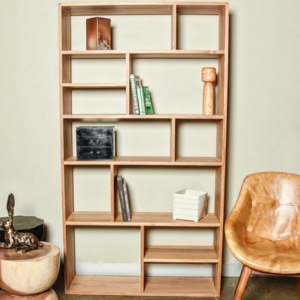 A finely crafted contemporary bookcase made from sustainably sourced solid teak (not veneer or laminated) with a natural wax finish.