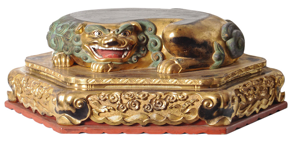 Hexagonal Japanese Buddhist base for a statue with a recumbent shi-shi (guardian lion dog), gilded and carved with inset glass eyes